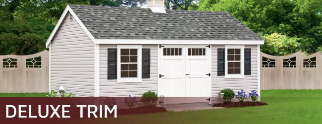Vinyl storage shed with deluxe trim