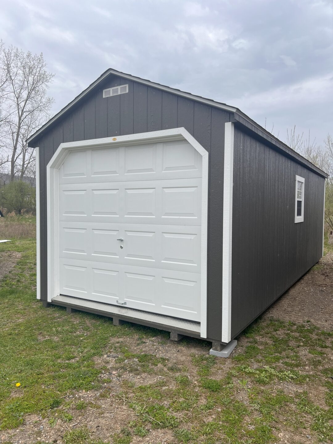 Gray garage with white trim and white overhead door
