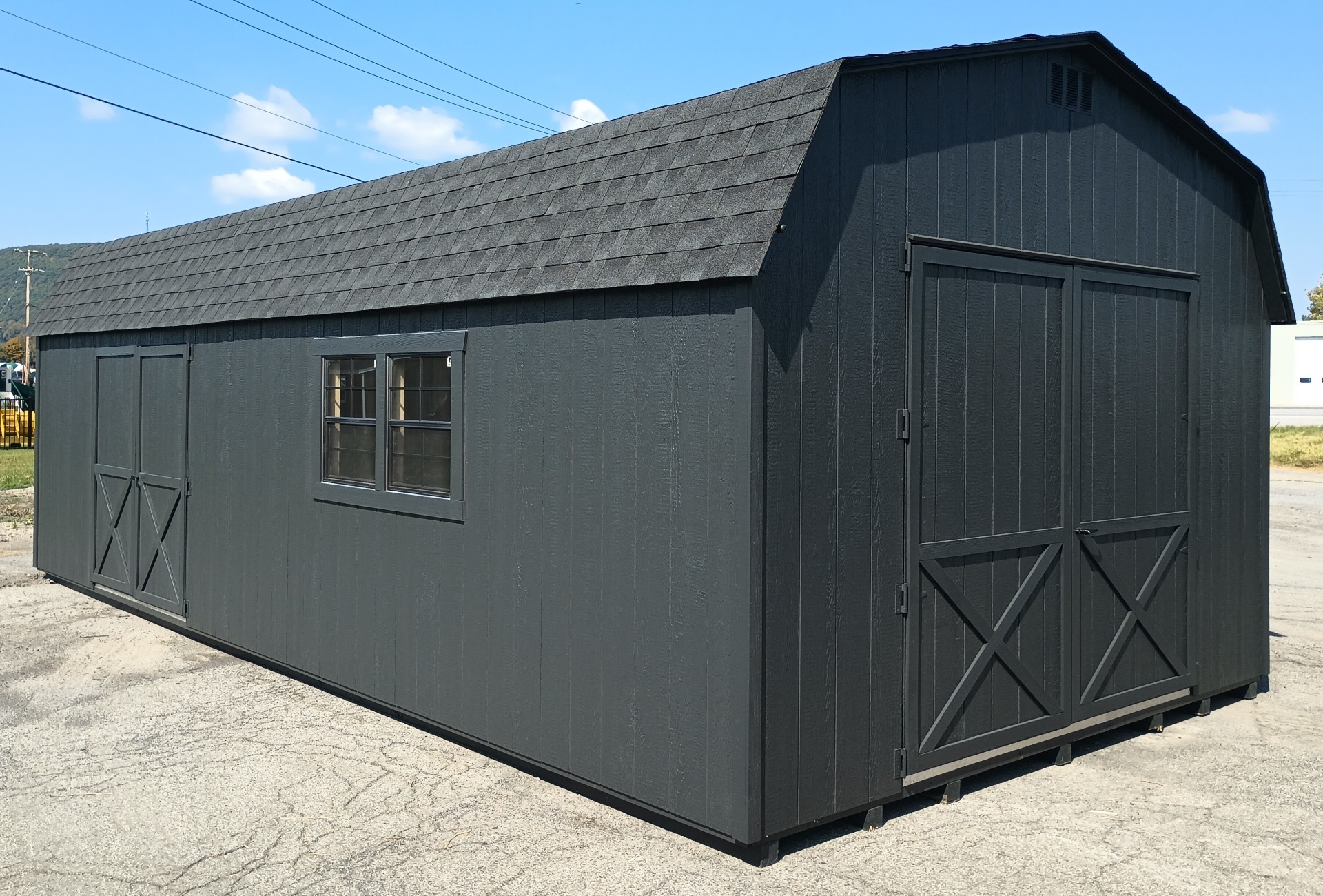 Large shed with 2 sets of doors, windows and shingled roof